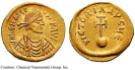 These are Byzantine coins produced from 610 - 613 which depict emperor Heraclius.